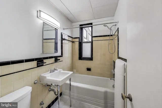 a bathroom with a sink a bath tub and a shower