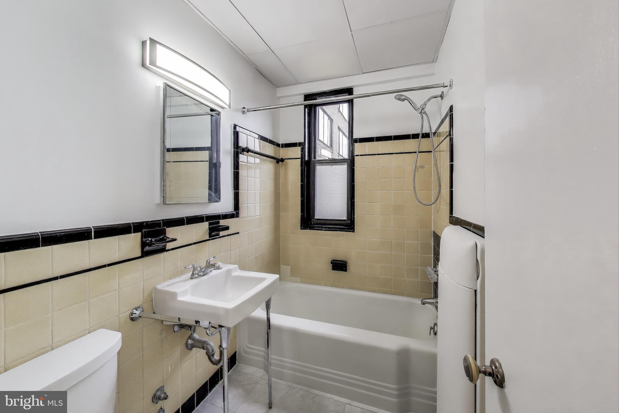 1 Scott Circle Northwest, Unit 121 Washington, DC 20036 - Photo 12 of 30 a bathroom with a sink a bath tub and a shower