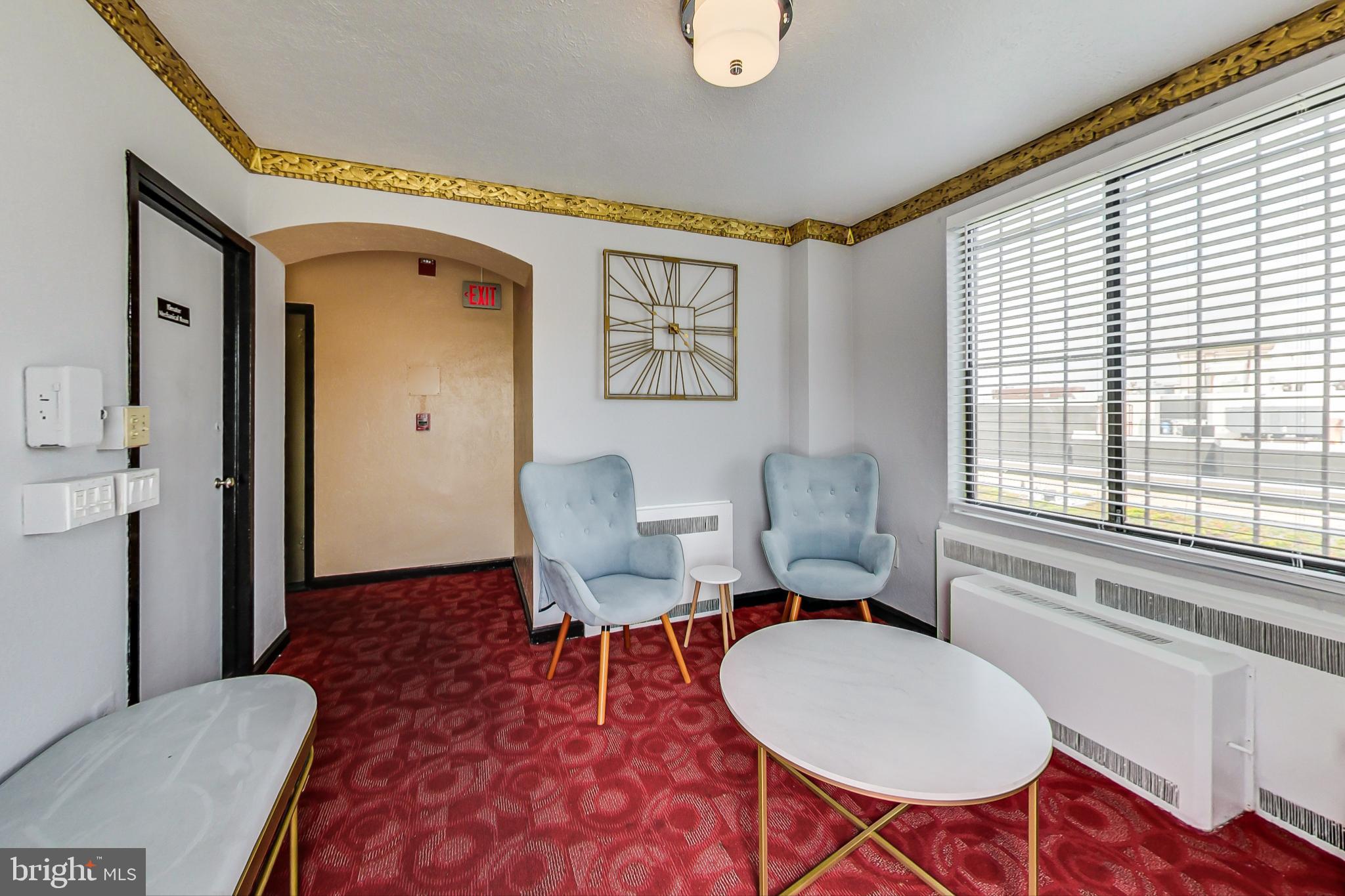 1 Scott Circle Northwest, Unit 121 Washington, DC 20036 - Photo 16 of 30 a living room with furniture a rug and a window