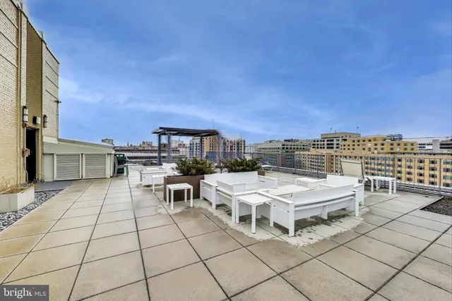 a view of city from terrace with seating space
