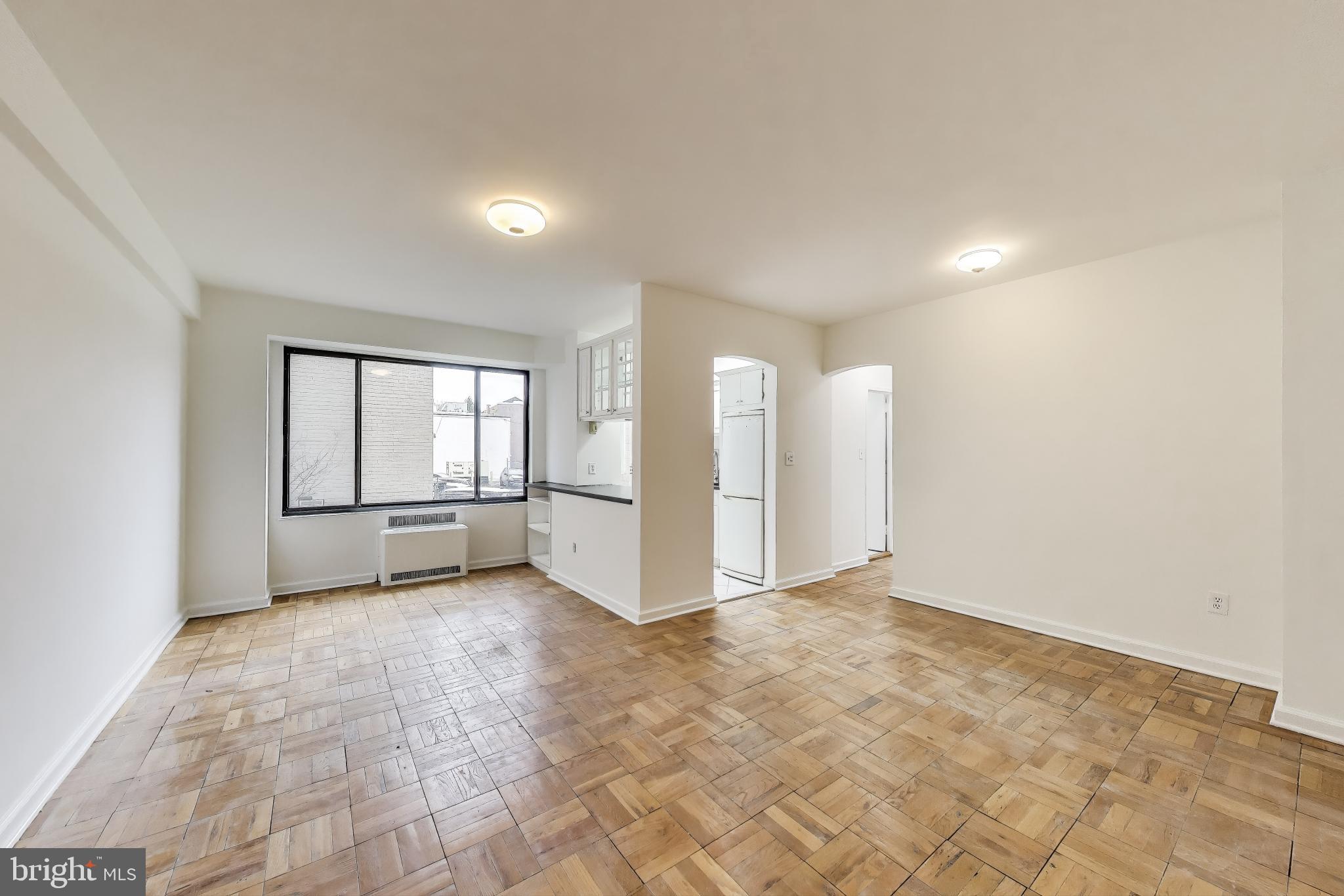 1 Scott Circle Northwest, Unit 121 Washington, DC 20036 - Photo 2 of 30 an empty room with windows and closet