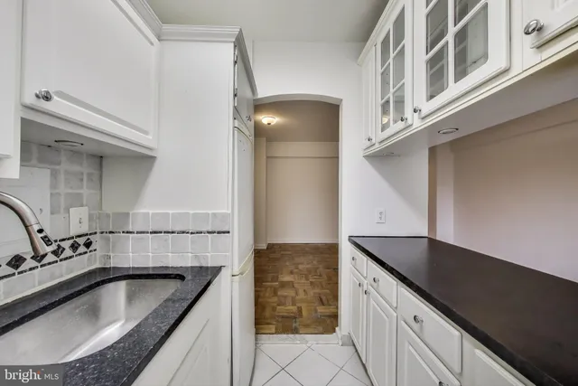 a kitchen with a sink and a stove
