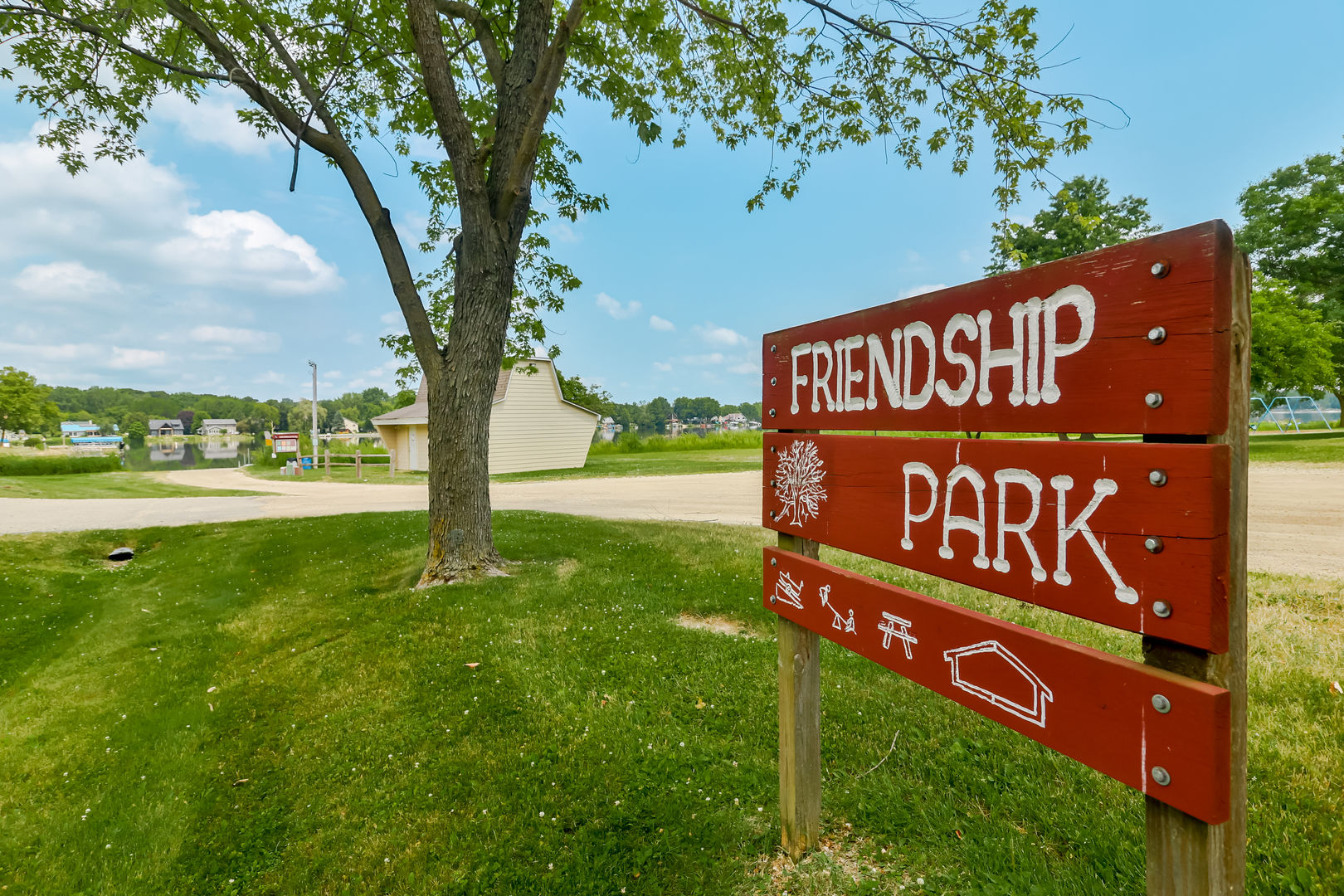 139 Pembroke Road Southwest Poplar Grove, IL 61065 - Photo 20 of 23 a view of a street sign under a large tree