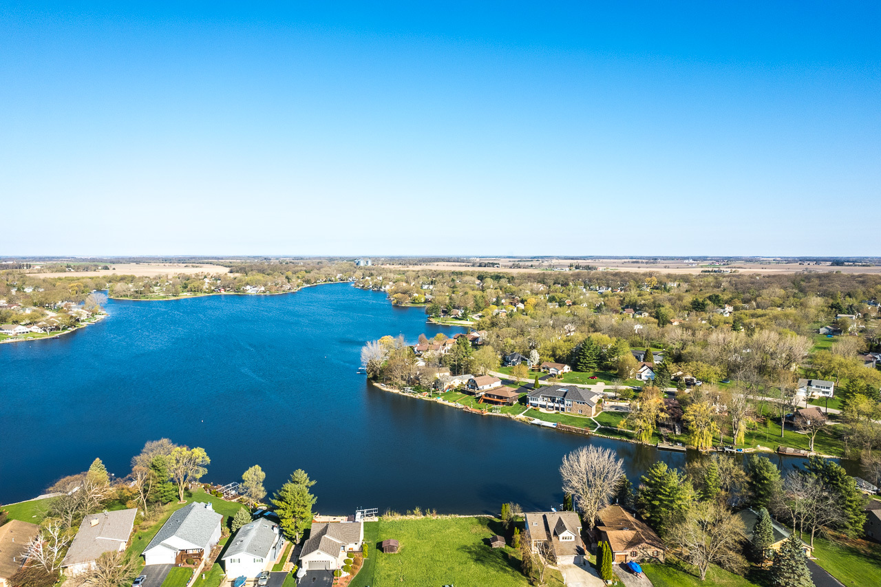 139 Pembroke Road Southwest Poplar Grove, IL 61065 - Photo 8 of 23 a view of a lake with a mountain