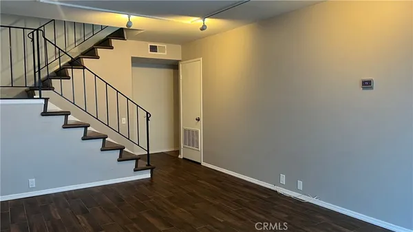 a view of entryway with wooden floor