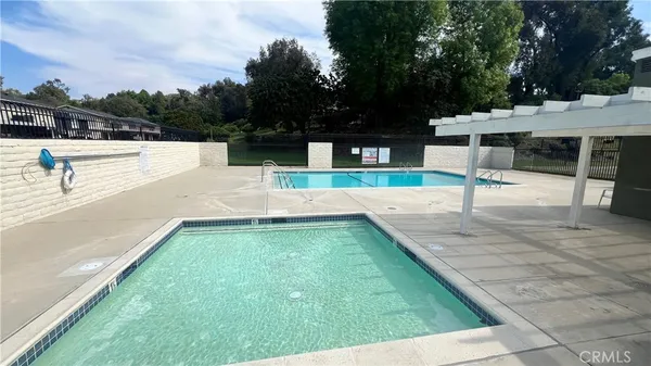 a view of a swimming pool with a lounge chair