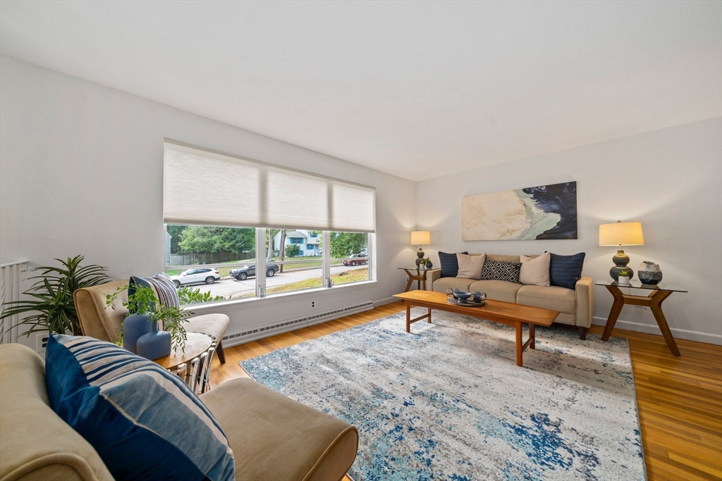 12 Tall Tree Road Sharon, MA 02067 - Photo 3 of 26 a living room with furniture and a large window