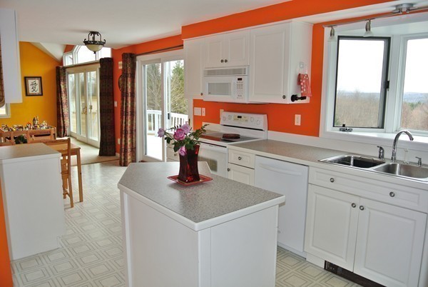 10 Osgood Road Sterling, MA 01564 - Photo 6 of 30 a kitchen with stainless steel appliances granite countertop a sink and a white cabinets