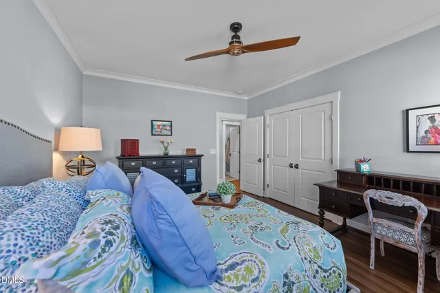 a view of an empty room with window and cabinet