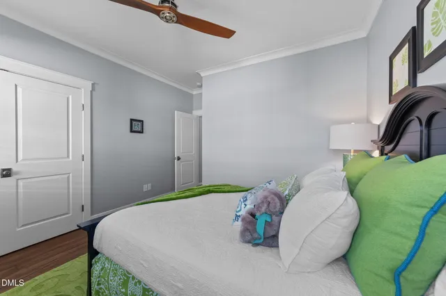 a bathroom with a granite countertop sink mirror vanity and toilet