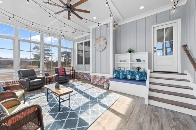 a bedroom with a bed couch and a window