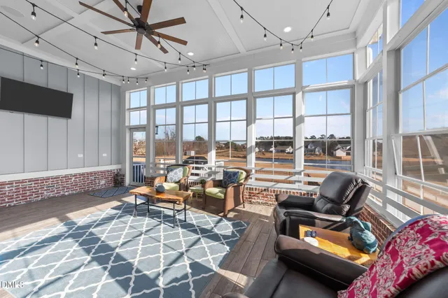 a living room with furniture and a table