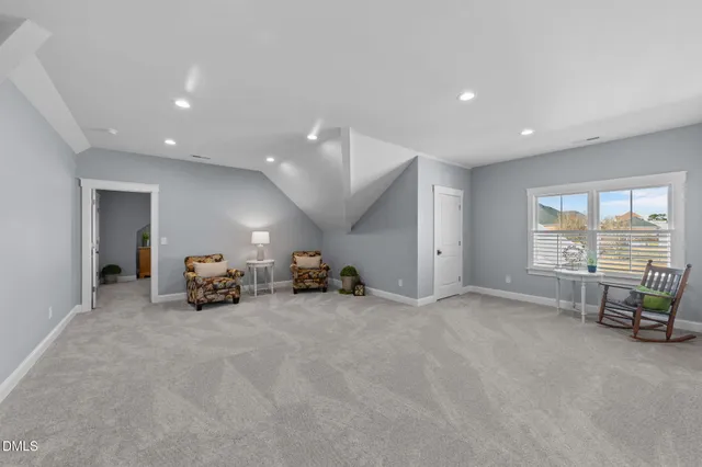 a spacious bedroom with a bed and a walk in closet