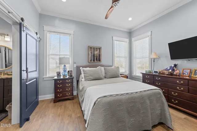 a kitchen with sink refrigerator and microwave
