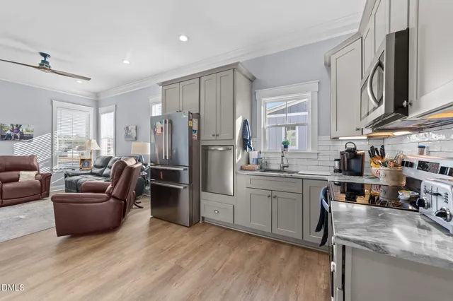 a view of a house with yard and staircase