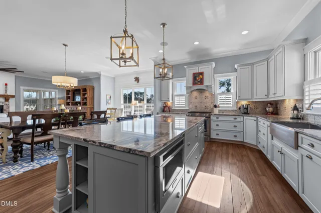 a kitchen with stainless steel appliances granite countertop a stove and a granite counter tops