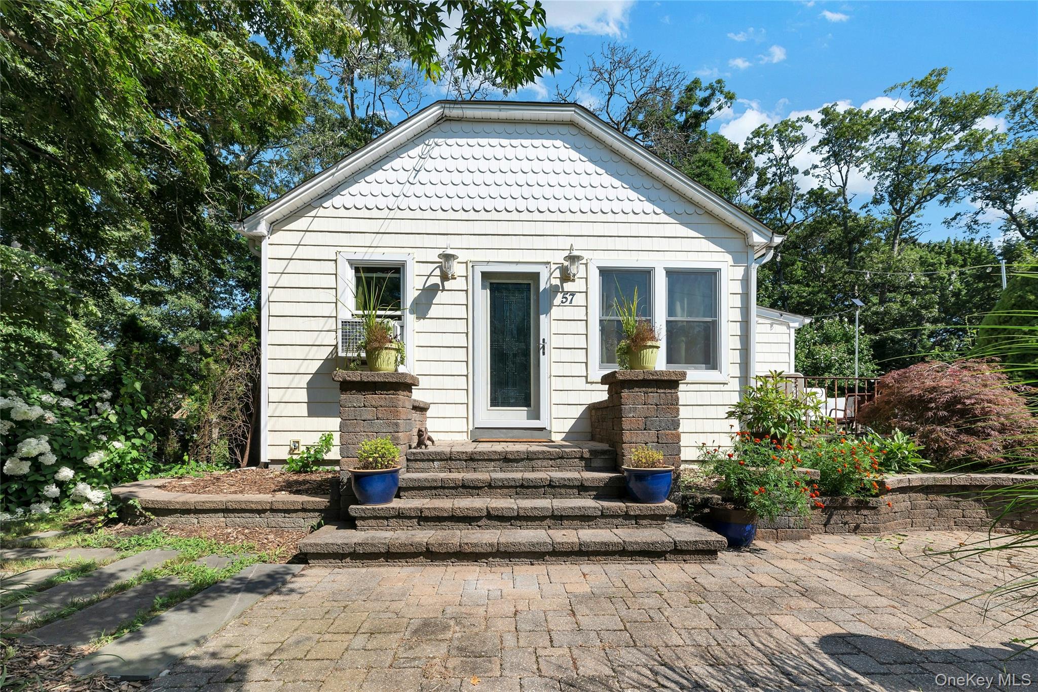 57 Flower Road Mastic Beach, NY 11951 - Photo 1 of 1 Charming Ranch With Beautiful Paver Walkway