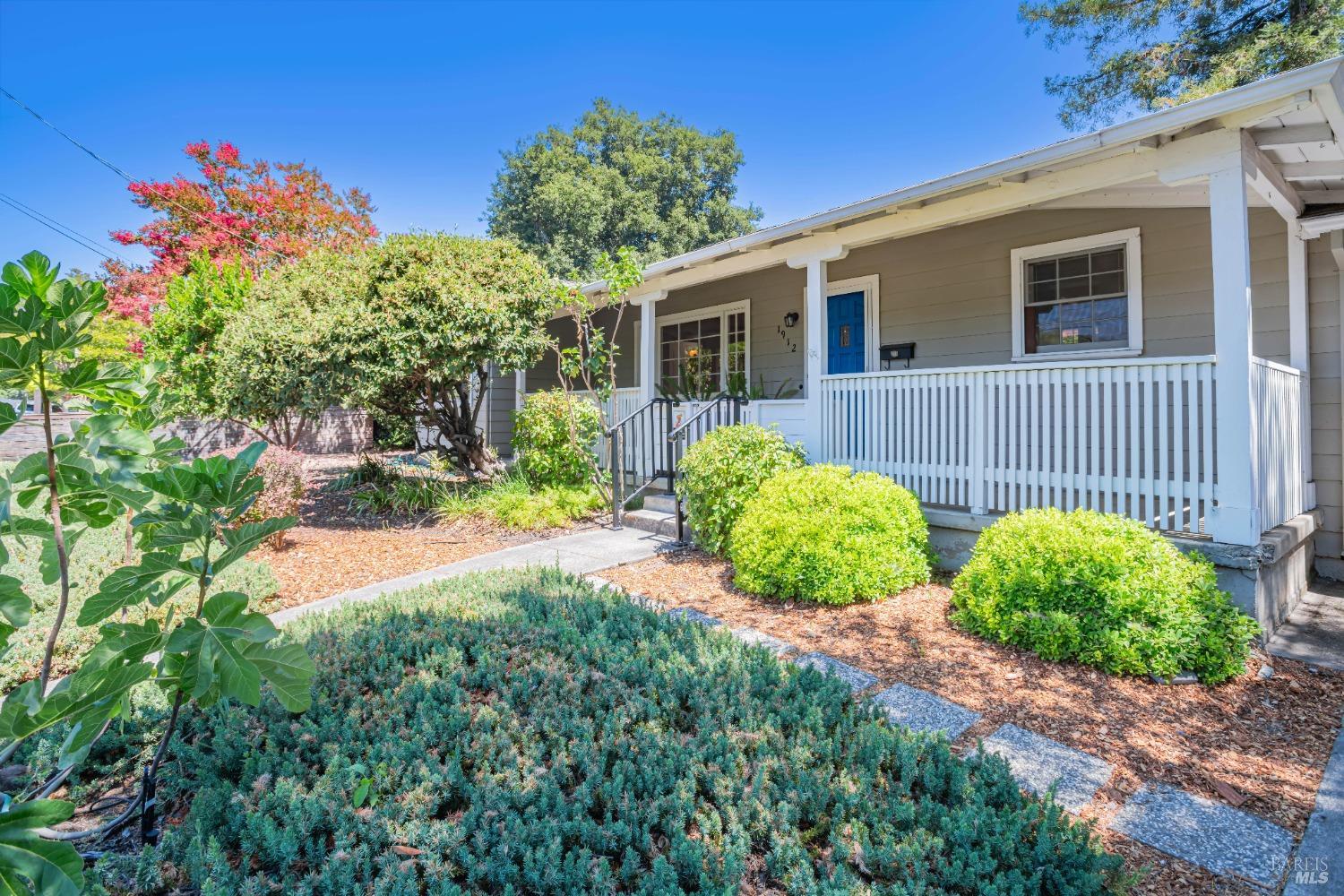 a front view of a house with garden