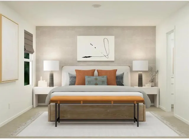 a bedroom with a bed and lamp