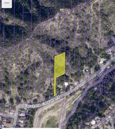 a green field with some trees