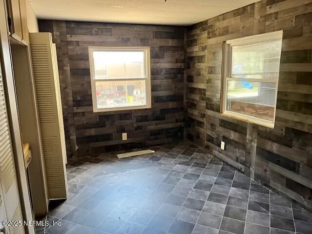 a bathroom with a bathtub and window