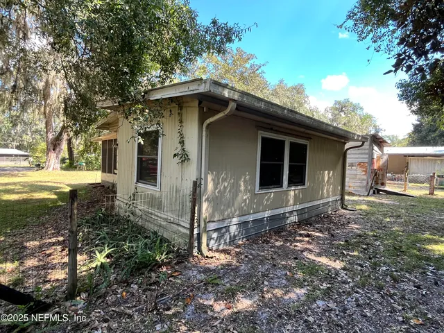 a house with trees in the background