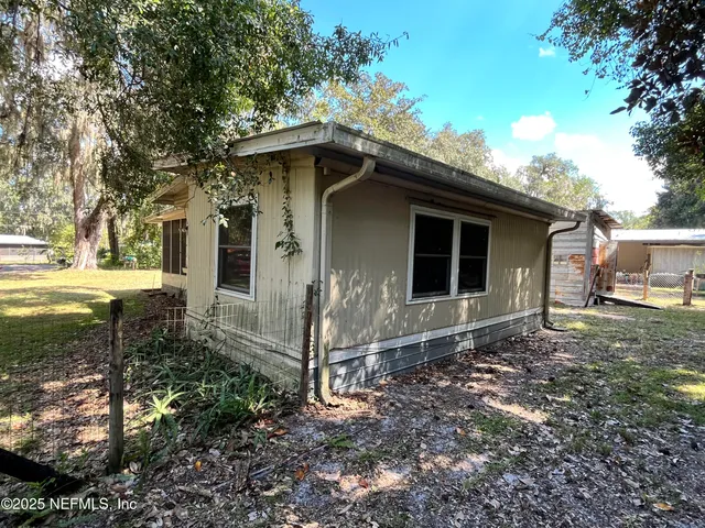 a house with trees in the background