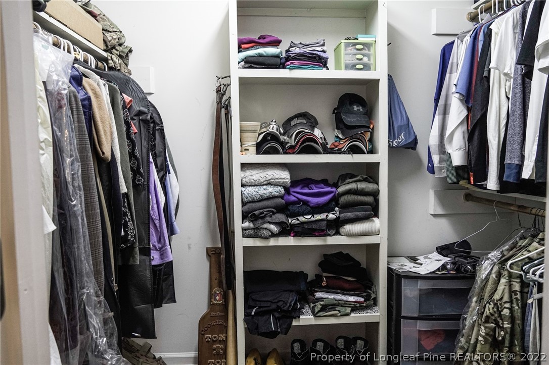 720 Riyhad Road Fayetteville, NC 28314 - Photo 15 of 22 a view of walk in closet with clothes and shoes