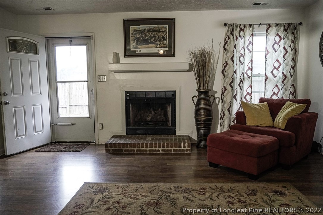720 Riyhad Road Fayetteville, NC 28314 - Photo 8 of 22 a living room with furniture and a fireplace
