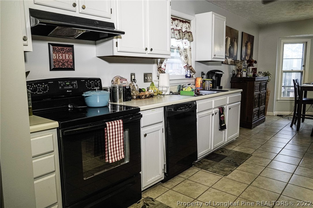 720 Riyhad Road Fayetteville, NC 28314 - Photo 10 of 22 a kitchen with stainless steel appliances a stove a sink and cabinets