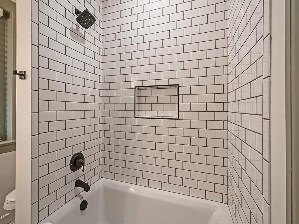 628 North Euclid Avenue, Unit 2 Pittsburgh, PA 15206 - Photo 19 of 27 a bathroom with a bathtub and shower