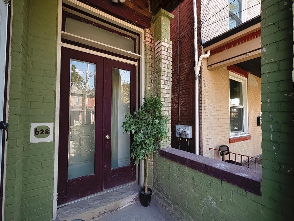 628 North Euclid Avenue, Unit 2 Pittsburgh, PA 15206 - Photo 2 of 27 a front view of a house with a yard