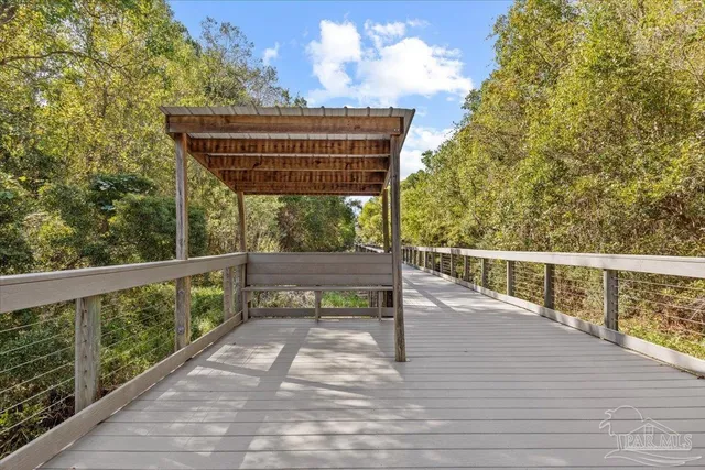 a view of deck with wooden floor and outdoor seating