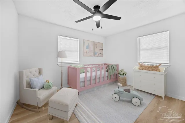 a bedroom with furniture and a window