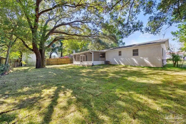 a view of a house with a yard
