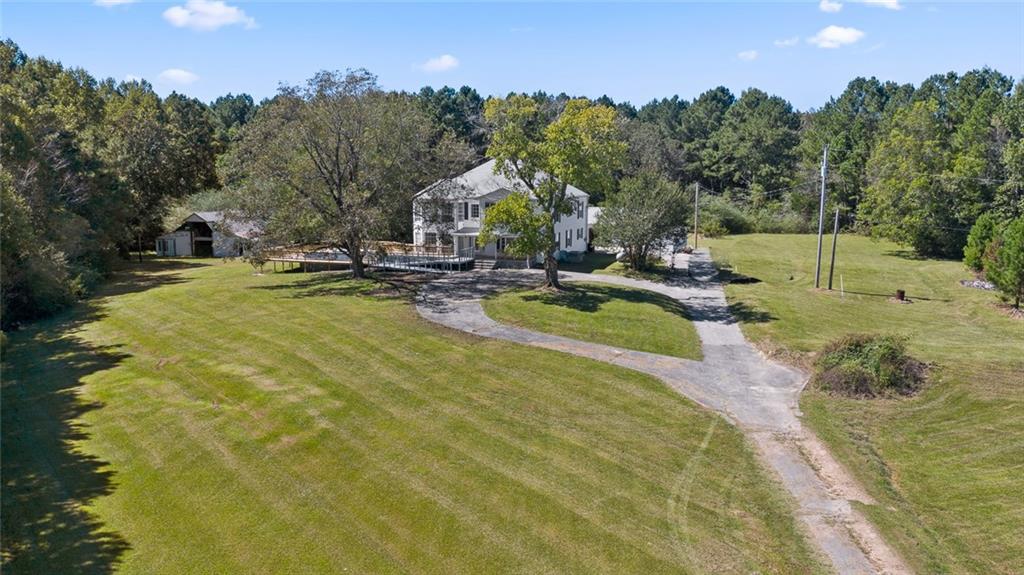 491 Williams Road Summerville, GA 30747 - Photo 1 of 1 a view of a swimming pool with a house