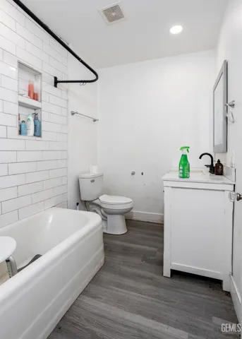 a bathroom with a sink toilet and a bathtub
