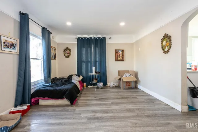 a bedroom with a bed and a window