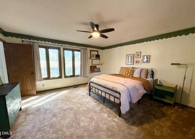 625 McCray Road Burlington, NC 27217 - Photo 15 of 38 a spacious bedroom with a bed and a large window