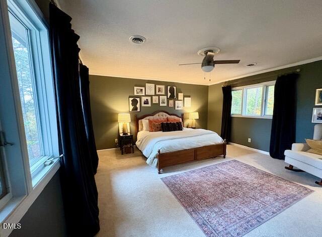 625 McCray Road Burlington, NC 27217 - Photo 16 of 38 a bedroom with a bed lamp and a dresser