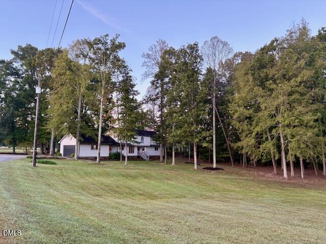 625 McCray Road Burlington, NC 27217 - Photo 2 of 38 a view of a swimming pool with a house in the background