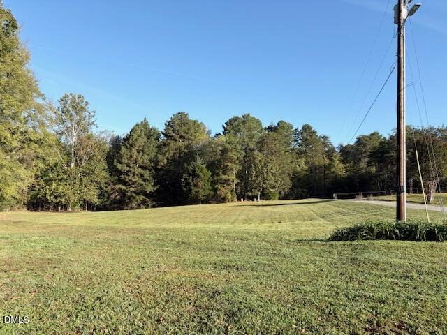 625 McCray Road Burlington, NC 27217 - Photo 30 of 38 a view of a field with trees in the background