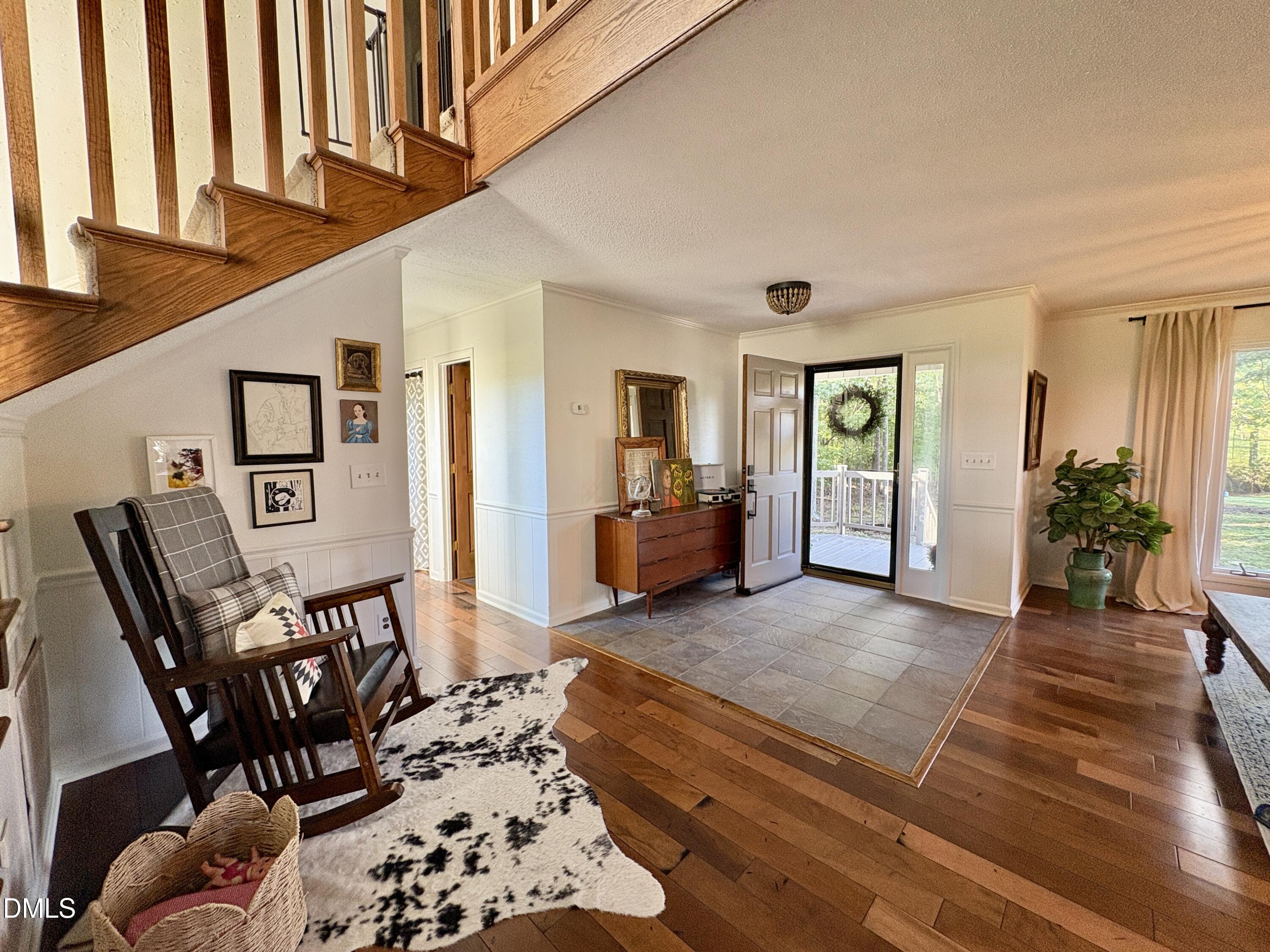 625 McCray Road Burlington, NC 27217 - Photo 6 of 38 a living room with furniture a rug and a large window