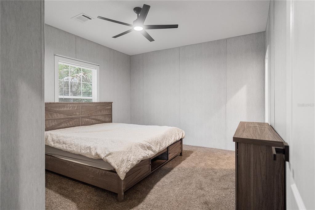 375 Sapp Street Inglis, FL 34449 - Photo 20 of 36 a bedroom with a bed and a window