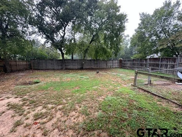 a swimming pool with wooden fence