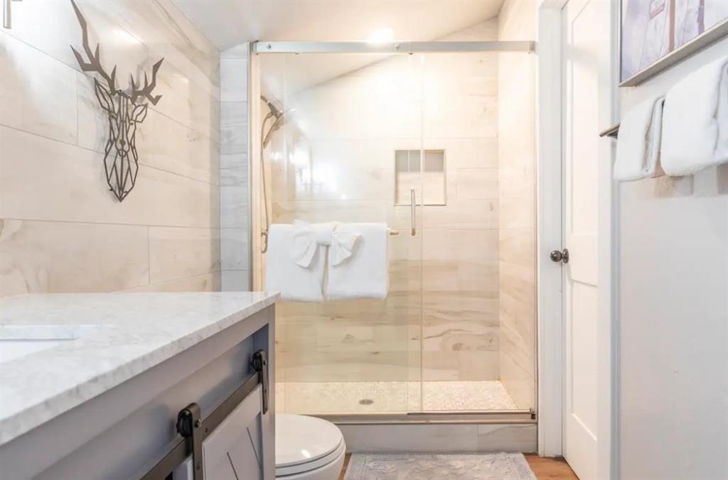 137 Laurel Mountain Road, Unit 418 Mammoth Lakes, CA 93546 - Photo 11 of 23 Full bathroom featuring vanity and a shower stall