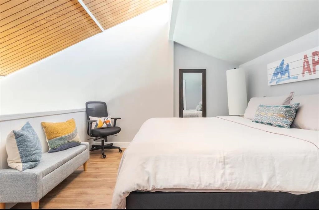 137 Laurel Mountain Road, Unit 418 Mammoth Lakes, CA 93546 - Photo 13 of 23 Bedroom with vaulted ceiling and light wood-type flooring