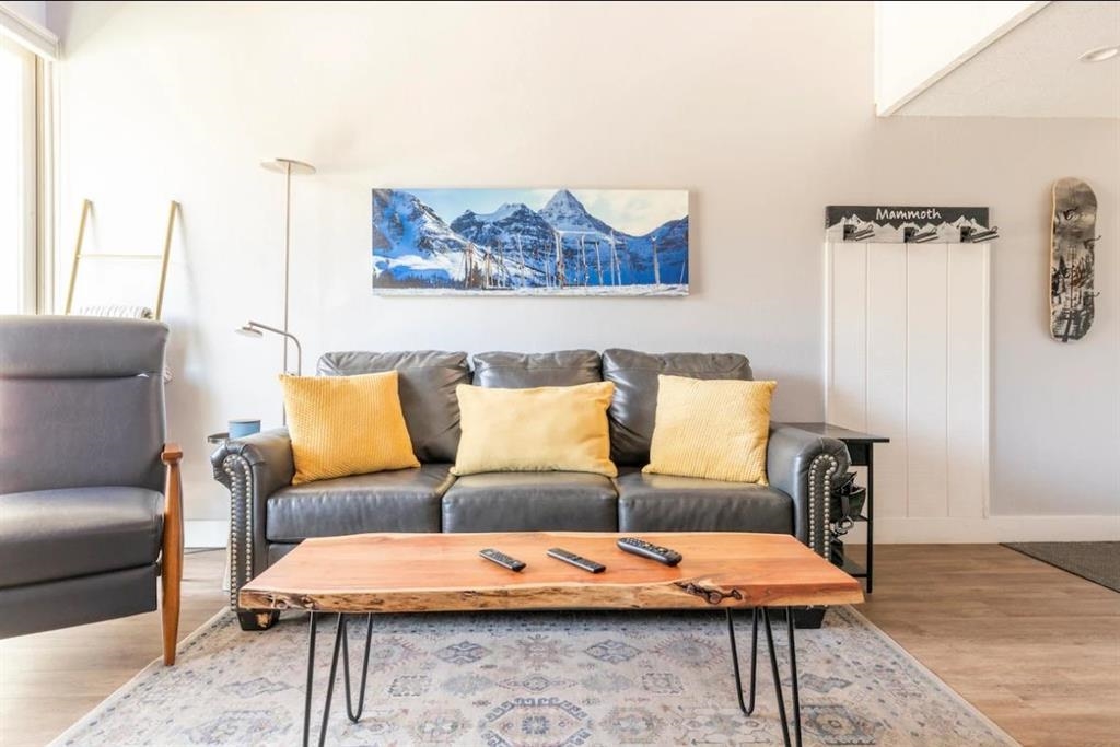137 Laurel Mountain Road, Unit 418 Mammoth Lakes, CA 93546 - Photo 6 of 23 Living area featuring wood finished floors and baseboards