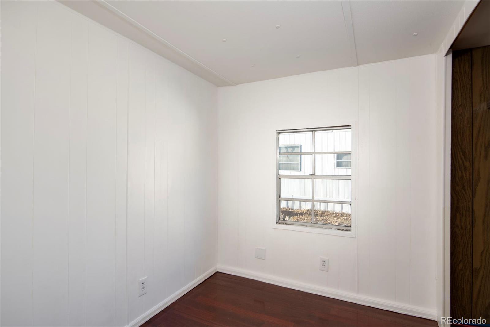 5000 Butte Boulder, CO 80301 - Photo 13 of 30 an empty room with wooden floor and windows