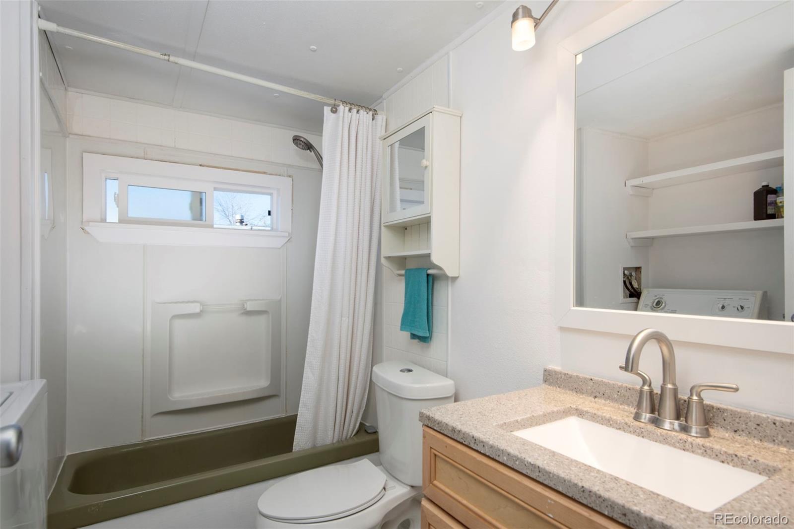 5000 Butte Boulder, CO 80301 - Photo 14 of 30 a bathroom with a sink a toilet and shower